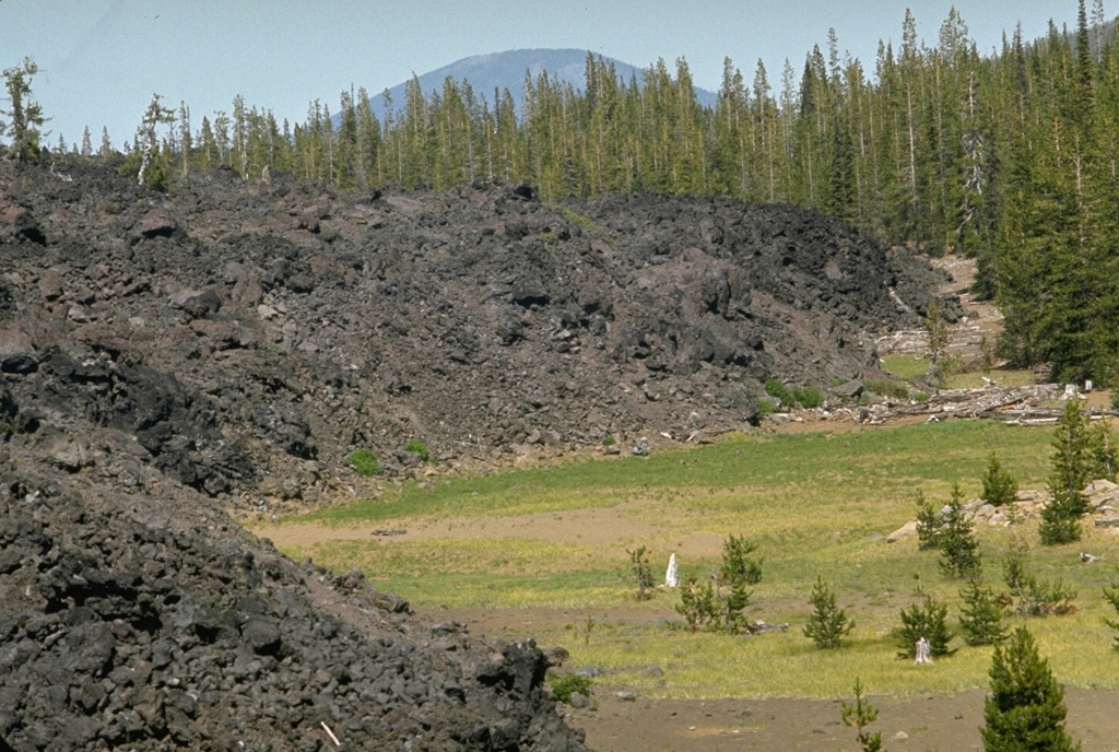 This blocky lava flow in the McKenzie Pass area of the central Oregon Cascades originated from Yapoah scoria cone on the north flank of North Sister about 2,600-2,900 years ago. The flow traveled 5 km to the north before being deflected by lava flows from the Belknap and Little Belknap shield volcanoes and then flowed an additional 8 km to the NE. Photo by Lee Siebert, 1972 (Smithsonian Institution).