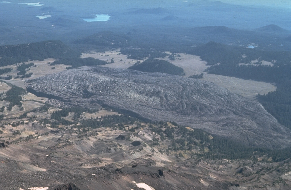 The Rock Mesa obsidian lava flow is seen here in an aerial view from the north above South Sister volcano. It is the largest of a series of lava flows which erupted about 2,300 to 2,000 years ago from vents on the SW and SE flanks. Photo by Dan Miller, 1977 (U.S. Geological Survey).