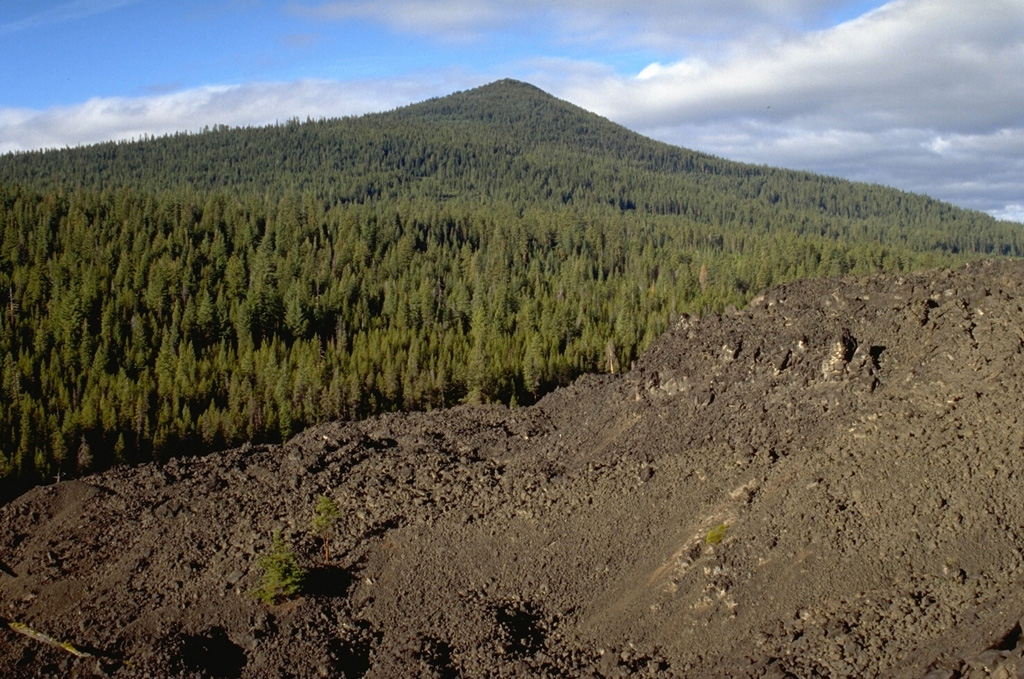The southernmost of three andesite lava flows near Davis Lake originated from Black Rock Butte and banks up against the slopes of the Pleistocene Odell Butte shield volcano. The lava flow is considered to have erupted at about the same time as a nearby lava flow with a radiocarbon age of 5,050-5,600 years. Photo by Lee Siebert, 1995 (Smithsonian Institution).