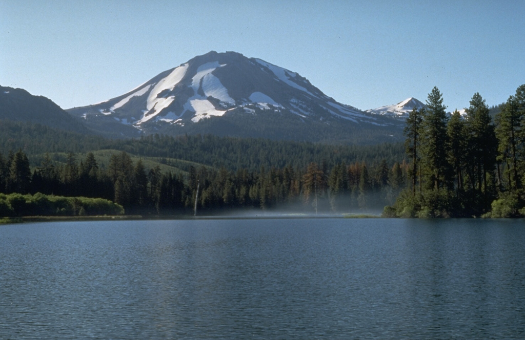 Lassen Peak, rising above Manzanita Lake on the NW, is the focal point of the Lassen volcanic center, a concentration of volcanic features covering much of Lassen National Park.  The massive lava dome forming Lassen Peak was constructed about 25,000 years ago and was the site of California's most recent eruption during 1914-1917.  Chaos Crags, a lava dome complex on the north flank, and the aptly named Cinder Cone to the NE, have also erupted within the past 1200 years. Photo by Dave Wieprecht, 1995 (U.S. Geological Survey).