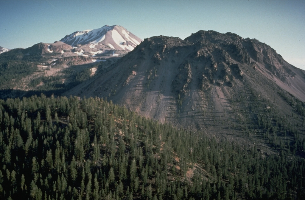 Chaos Crags in the foreground and Lassen Peak in the background are large lava dome complexes in the southern Cascade Range. Chaos Crags consists of a group of six overlapping rhyodacite lava domes that erupted around 1,100 years ago. Lassen last erupted during 1914-17. Photo by Dan Dzurisin, 1982 (U.S. Geological Survey).