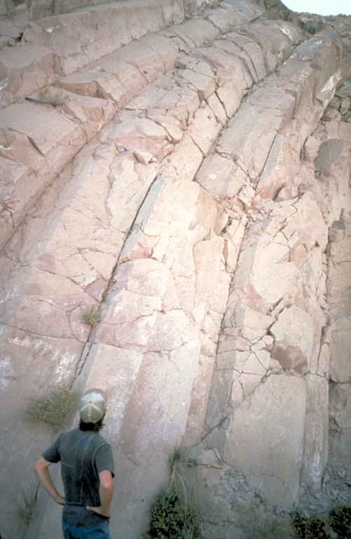 Curved cooling joints in the Bishop Tuff deposit form a dramatic pattern in the Owens River Gorge of the Long Valley caldera.  Eruption of 500 cu km of material about 760,000 years ago resulted in collapse of the 17 x 32 km caldera. Photo by Larry Mastin, 1992 (U.S. Geological Survey).
