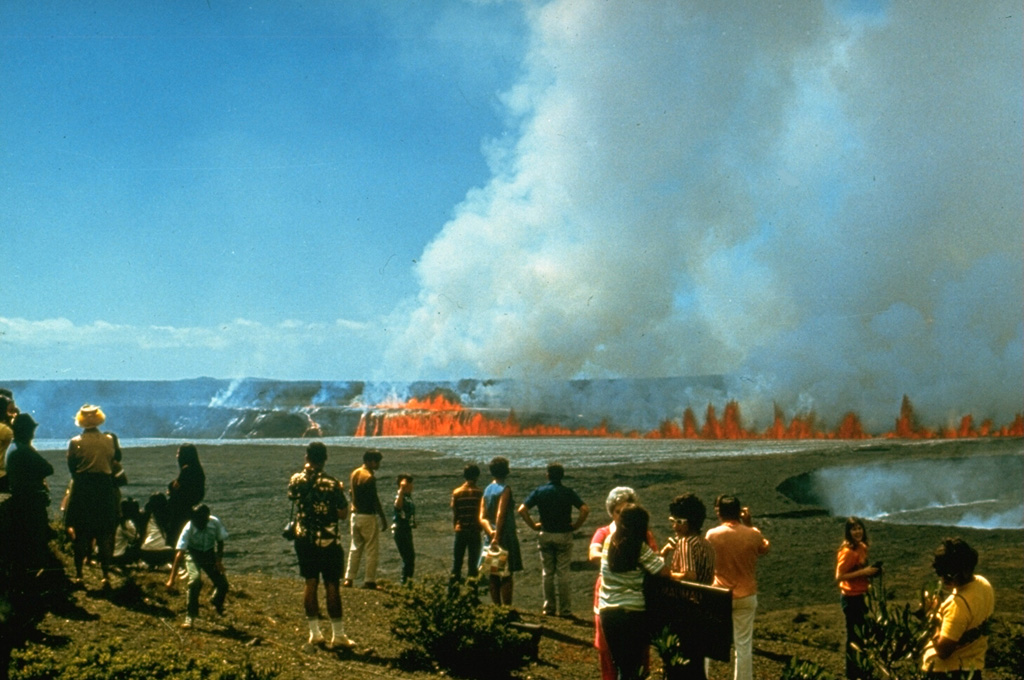 On 14 August 1971 a line of lava fountains erupted across the floor of Kilauea caldera. The 10-hour eruption was observed by tourists from overlooks along the road around the caldera. The fissure that opened across Halema‘uma‘u crater produced lava flows both on its floor and within the caldera on either side. Photo by Hawaii Volcanoes National Park, 1971.