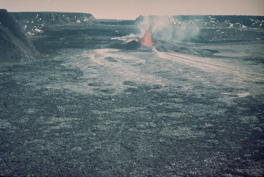 This 12 April 1940 photo shows a lava fountain within the Mauna Loa Moku‘āweoweo caldera from the SE. The eruption began during the night of 7 April from fissures that soon migrated down the SW rift zone. A 6-km-long fissure produced lava flows that covered two-thirds of the caldera floor. The eruption lasted until 18 August.  Photo by G.O. Fagerlund (U.S. Geological Survey).