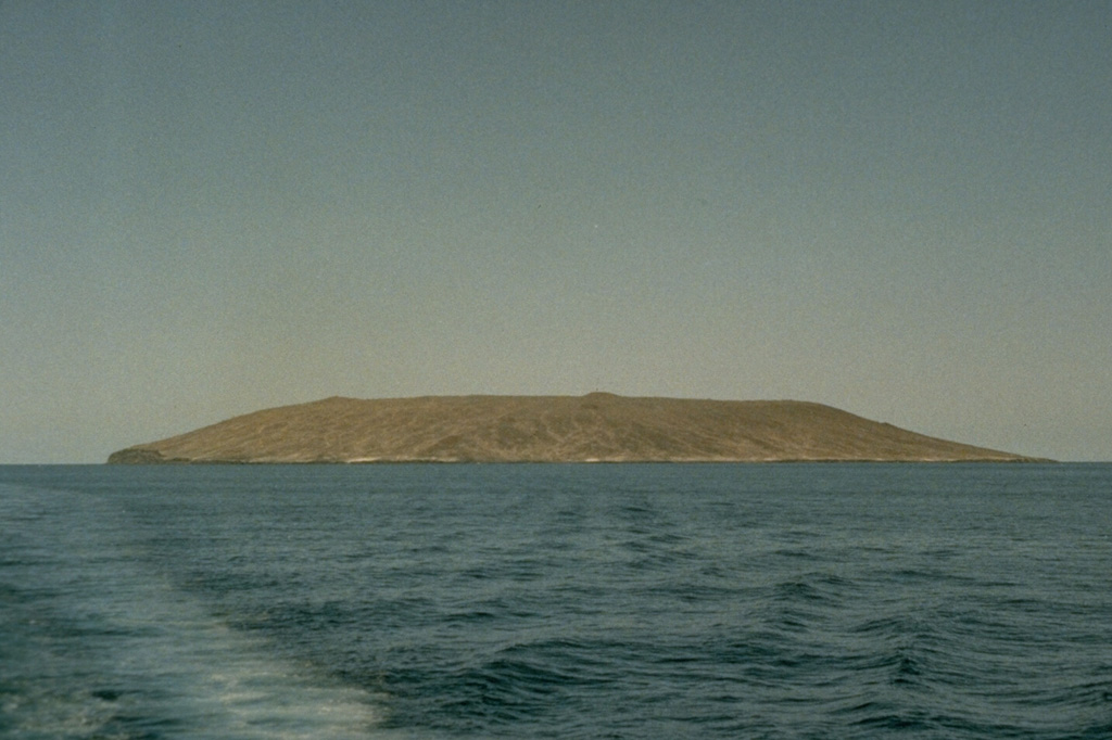 Isla Tortuga is 4-km-wide volcanic island located in the Gulf of California, 40 km off the coast of Baja California. The summit contains a 1-km-wide caldera and recent lava flows cover much of the flanks. This 1989 view is from the west. Photo by Marjorie Summers, 1989 (Smithsonian Institution).