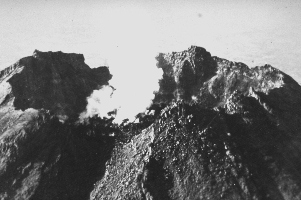 This 1958 photo shows a degassing lava dome in the 450-m-wide summit crater of Colima. Renewed dome growth had begun on 14 May 1957 after a period of quiescence since the early 1930's, and the dome rose 70 m by the end of the year. Dome growth continued for several years, and by 1961 lava began overflowing the crater rim. Photo by Guillermo Saucedo, 1958 (courtesy Julian Flores, University of Guadalajara).