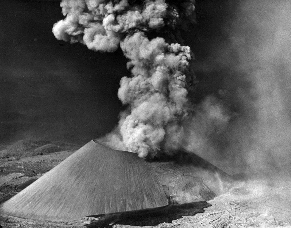 In mid-November 1944 lava broke out of the SSW base of the cone, below the south vent in the crater, seen here from the S. The Ahuán flow advanced over the earlier Taquí flows in the foreground. A small lava intrusion was exposed in the flank of the cone a short distance above the vent. Ahuán flows traveled around the east side of the cone and to the north. Photo by Frank Zierer, 1944 (published in Foshag and González-Reyna, 1956).