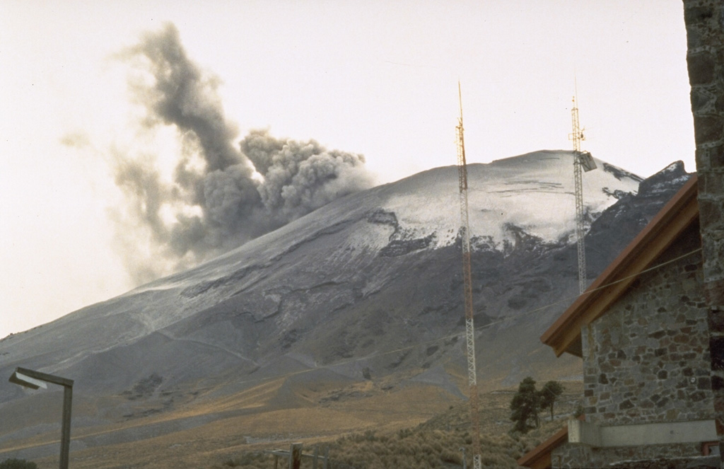 An ash plume rising from the summit crater of Popocatépetl in January 1995 as seen from the mountaineering lodge at Tlamacas, 4.5 km NNE of the summit. Phreatic eruptions that began on 21 December 1994 were the first from the volcano in almost a half century. Intermittent ash eruptions continued until May 1995 and then resumed in March 1996.  Photo by Dan Dzurisin, 1995 (U.S. Geological Survey).