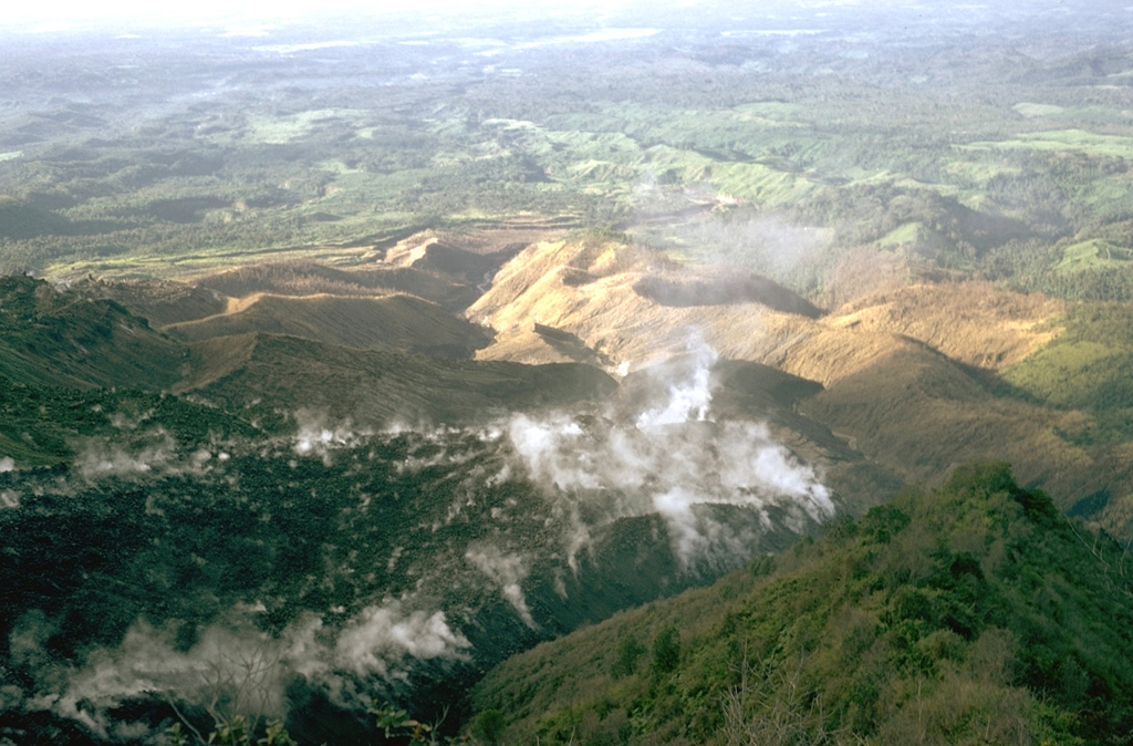 A lava flow from El Brujo, the westernmost of the Santiaguito vents, advances down a SW-flank valley in November 1973. An eruption phase in 1972-75 produced six lava flow units and a small lava dome. It was unusual in that extrusion took place simultaneously from two vents at the western and eastern ends of Santiaguito. Photo by William Melson, 1973 (Smithsonian Institution).