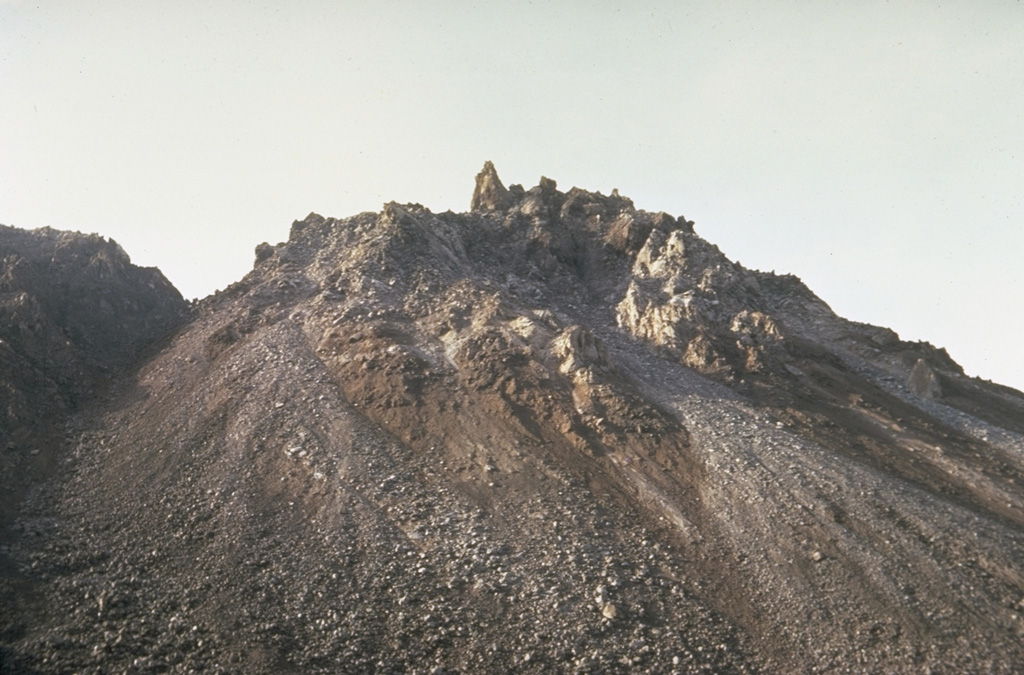 El Brujo vent at the western end of the Santiaguito lava dome complex was the youngest vent when this 10 August 1967 photo was taken from the north. The dome was not yet present in February 1954 aerial photographs, and may have begun growing following a strong explosive eruption on 14 April 1956. A large lava flow was extruded during 1959-63.  Photo by Dick Stoiber, 1967 (Dartmouth College).