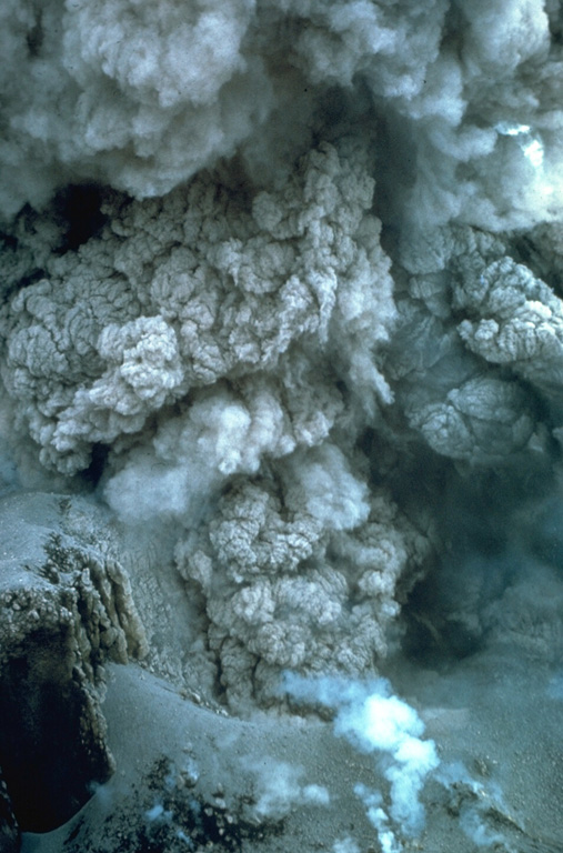 This closeup view of an ash plume rising from the El Brujo lava dome was taken on 13 November 1967. Explosions such as these are common at the growing lava dome, sometimes occurring within minutes of each other. The crater wall is visible at the lower left. Photo by Charles Pineo, 1967 (Dartmouth College, courtesy of Dick Stoiber).