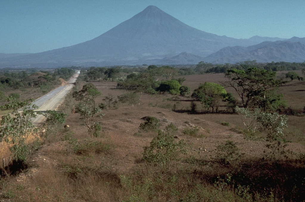 Volcán de Agua towers above the Pacific coastal plain to its south. The foreground surface is part of the massive Escuintla debris avalanche deposit most likely produced by collapse of the Acatenango-Fuego massif out of view to the left. Photo by Jim Vallance, 1989 (Michigan Technological University).