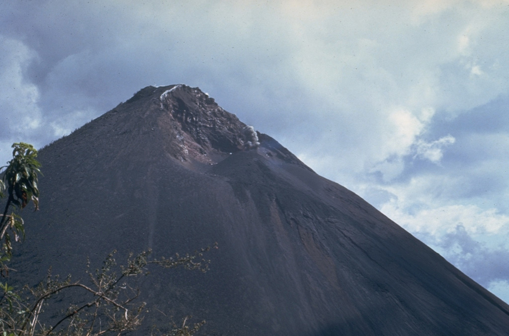 This February 1967 photo, taken from near Cerro Chino on the northern caldera rim, shows the morphology of the MacKenney crater early in the long-lived eruption that began at Pacaya in 1965. Neary continuous explosive activity with periodic lava effusion first began on 4 July 1965 from a 250-m-wide pit crater that had formed in 1962 without eruptive activity. Photo by Bill Rose, 1967 (Michigan Technological University).