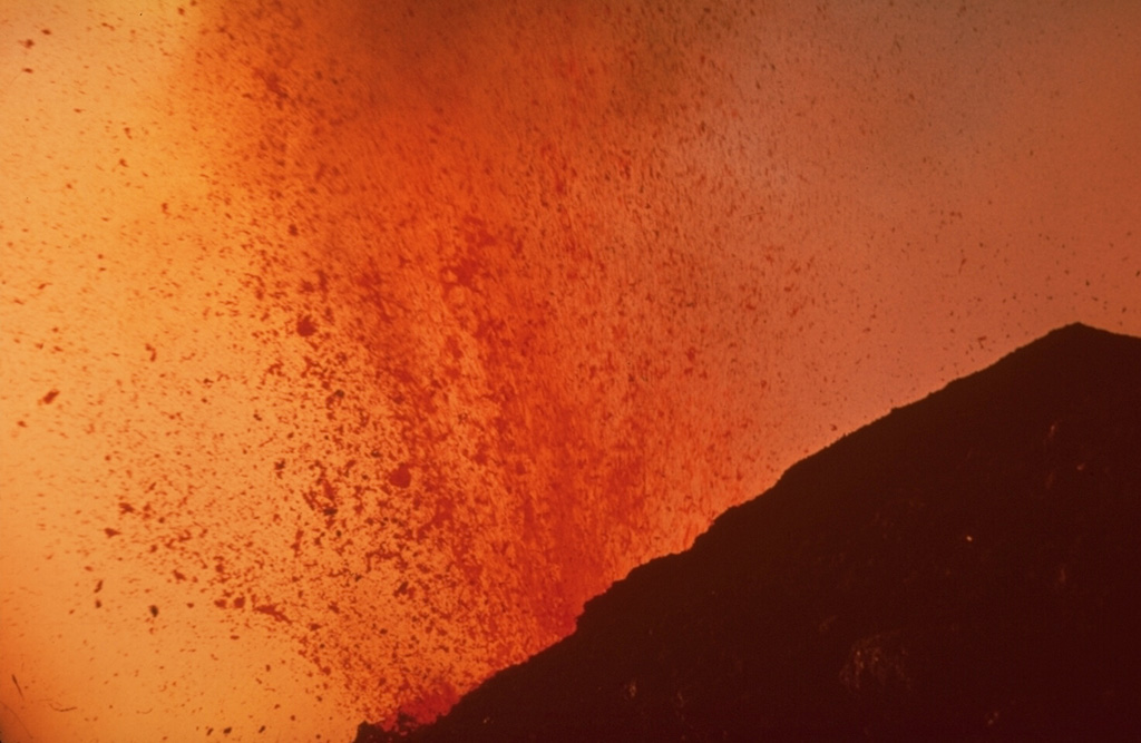 Molten lava bombs ejected from MacKenney crater at Pacaya fill most of this 1968 photo. Strombolian eruptions began at MacKenney crater in 1965 and continued for several decades. Photo by William Melson, 1968 (Smithsonian Institution).