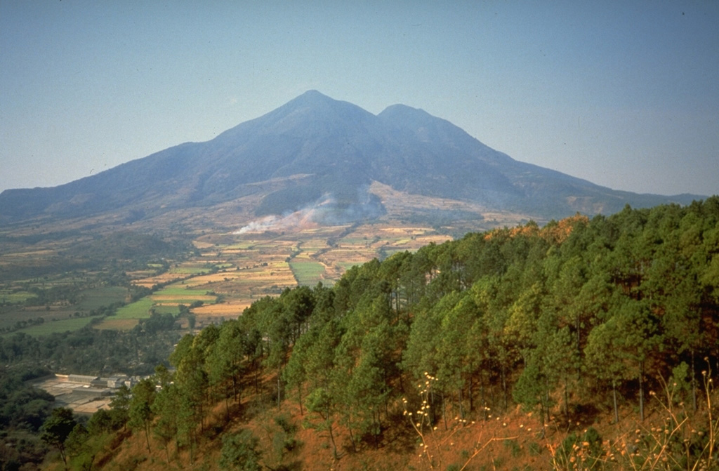 San Vicente is seen here from the north along the Pan-American highway. Numerous hot springs and fumaroles are found on its flanks. Photo by Kristal Dorion, 1994 (U.S. Geological Survey).