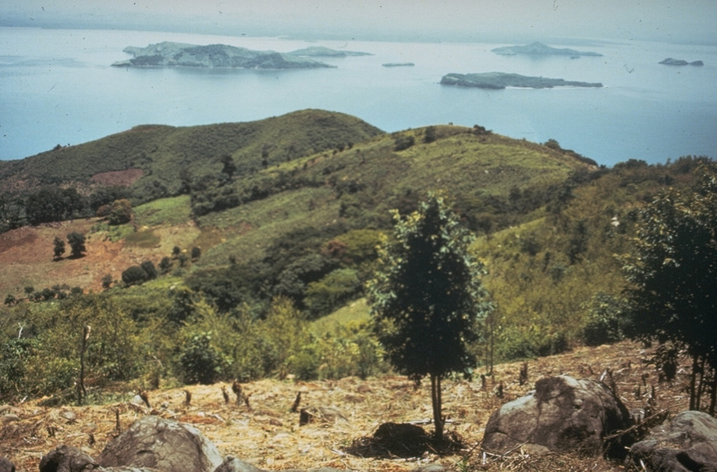 Islands dot the Gulf of Fonseca in this NE-looking view from Cerro el Havillal on Isla Conchagüita.  Isla Conchagüita is a small, 4-km-wide island across a narrow strait from Conchagua volcano.  Late-stage eruptions formed a small, sharp-topped cone with a 100-m-wide summit crater at the southern end of the island.  A crescent-shaped crater open to the west is located at the northern end of the island. Photo by Tom Crafford, 1973 (Dartmouth College, courtesy of Dick Stoiber).