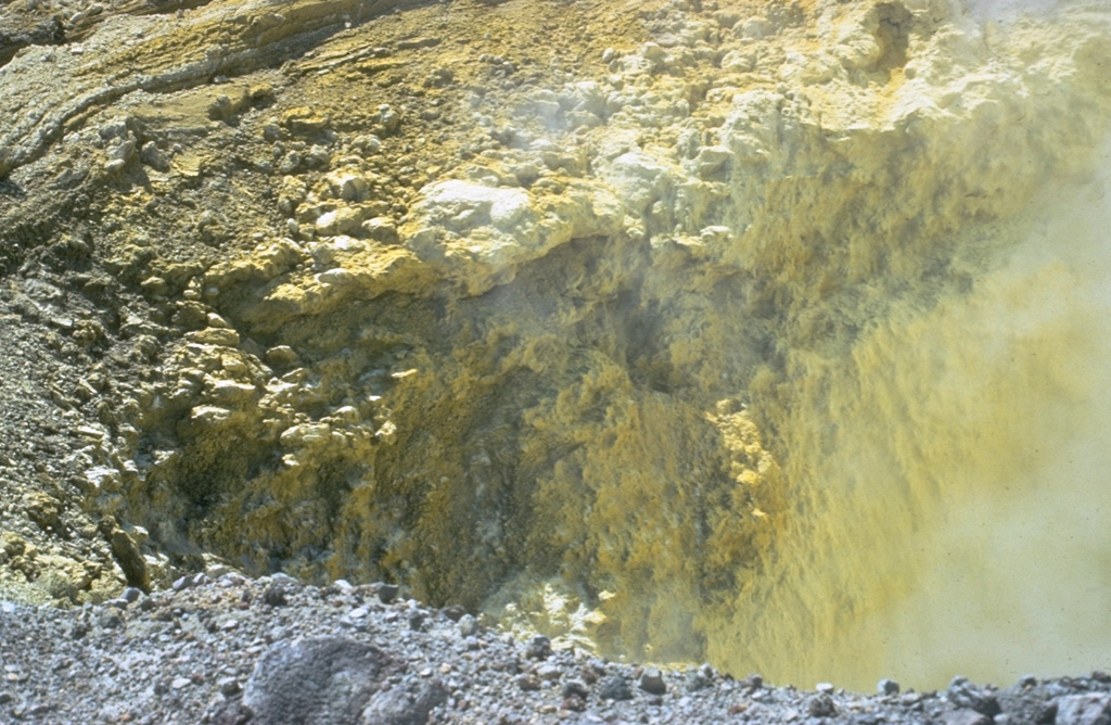 Precipitated sulfur lines the walls of a transverse fracture cutting the upper southern flank of Las Pilas volcano.  The fissure extends from the upper SE flank to El Oyo pit crater on the upper SW flank.  Fumaroles are particularly active at the SE end of the fissure. Photo by Bill Rose, 1967 (Michigan Technological University).