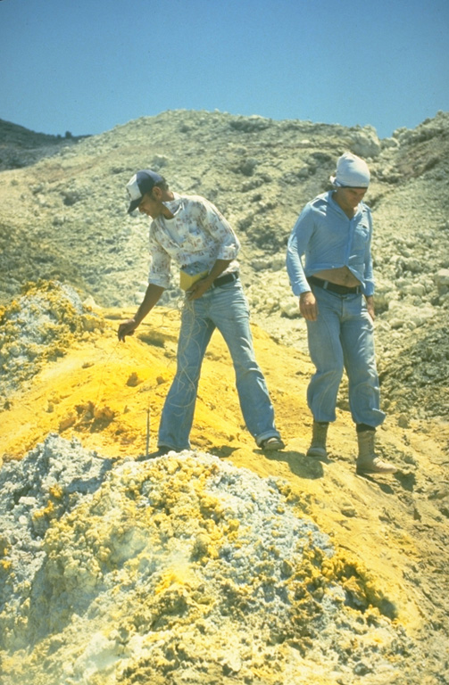The summit crater of Momotombo is covered with areas of extensive hydrothermal alteration, including this area of sulfur deposition.  Temperatures of 465-780° C were measured in summit crater fumaroles at the time of this visit in June 1980. Intense fumarolic activity occurs at the summit crater.  The summit crater fumaroles remained very hot in late 1980 with temperatures measured up to 735°C and reported to > 900°C.  Portions of the crater were seen to glow red and orange when observed at night. Photo by Mike Carr, 1980 (Rutgers University).