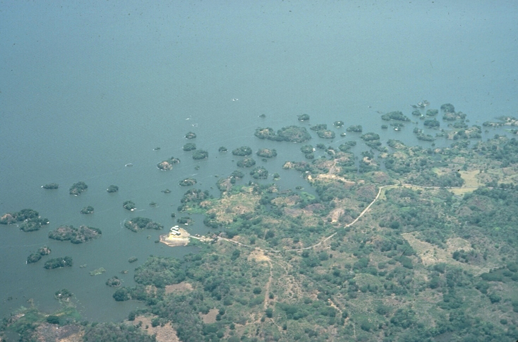 Las Isletas, a group of islands that were created by a large Holocene debris avalanche from Mombacho that swept into Lake Nicaragua. The avalanche traveled at least 12 km. The hummocky debris created an arcuate peninsula that extends into the lake as well as hundreds of small islands. This morphology is common where debris avalanches enter shallow bodies of water. Photo by Jaime Incer, 1972.