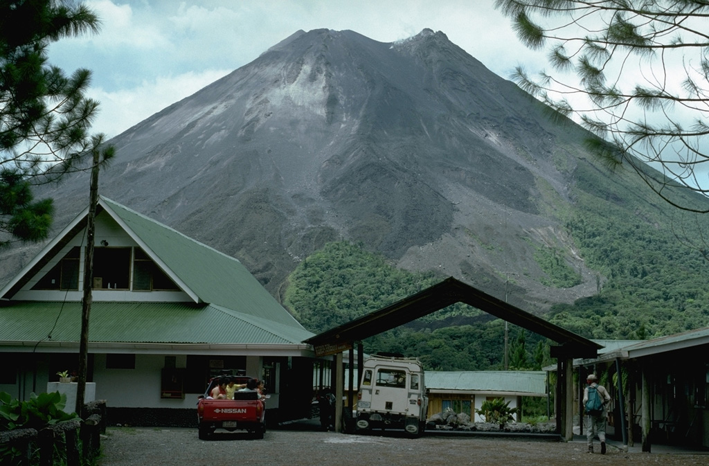 The Arenal Observatory Lodge was constructed at the site of a joint OVSICORI-UNA/Smithsonian Institution volcano observatory established on the SSW flank. The observatory building itself, out of view to the right, was used for seismic monitoring and visual documentation of the frequent eruptive activity from Arenal. This photo was taken in 1992. Photo by William Melson, 1992 (Smithsonian Institution).