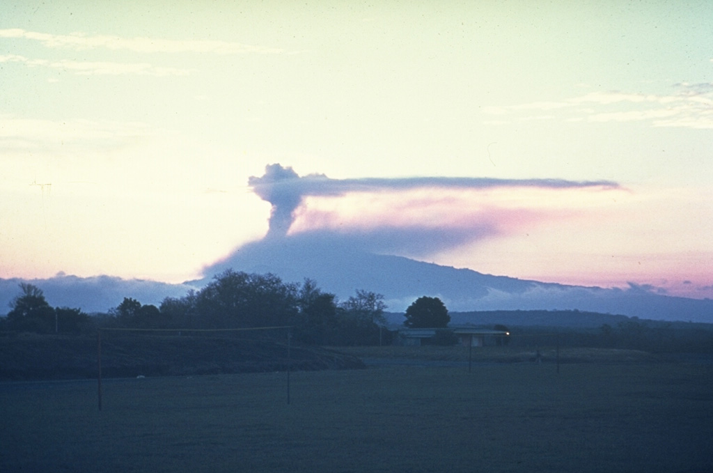 An ash plume above the summit of Irazú is seen in March 1963 from the old San José airport. Eruptions during 1963-65 were among the largest in historical time from the volcano. Intermittent mild-to-moderate explosive activity produced heavy ashfall that severely affected agricultural areas and caused economic disruption. Photo by Dick Stoiber, 1963 (Dartmouth College).