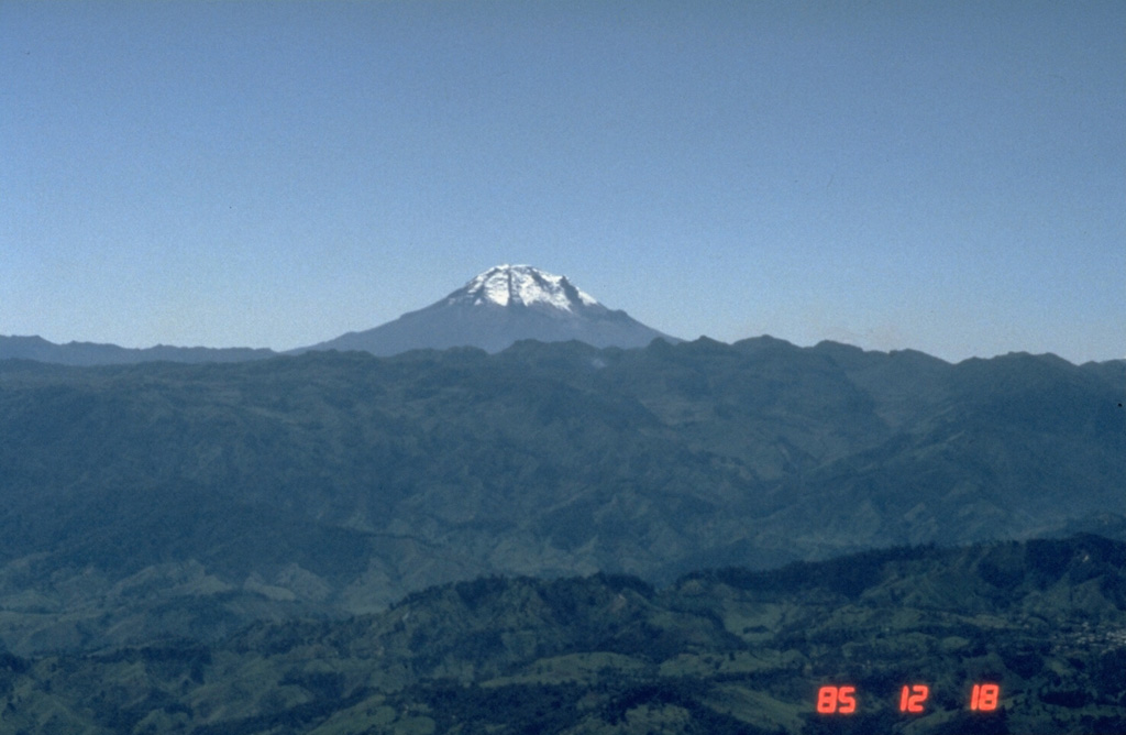 Nevado del Tolima rises to the south above the forested mountains of the Central Cordillera of Colombia. The summit consists of a late-Pleistocene to Holocene lava domes that were associated with thick lava flows and extensive pyroclastic flow deposits. A major eruption took place about 3,600 years ago and moderate historical eruptions have occurred in the 19th and 20th centuries.  Photo by Norm Banks, 1895 (U.S. Geological Survey).