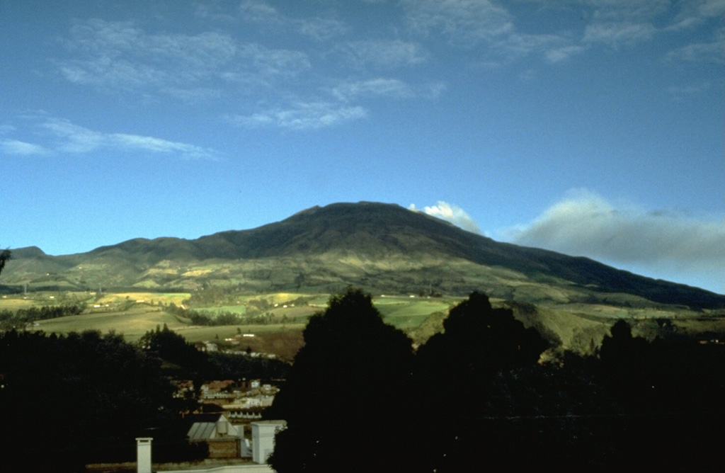 Galeras, one of the most active volcanoes of Colombia, rises west of the city of Pasto.  The high point is the eastern rim of a large caldera that is breached to the west and serves to funnel most of the eruptive products of the volcano away from the city.  Larger explosive eruptions during historical time have produced pyroclastic flows that overtopped the caldera rim. Photo by John Ewert, 1989 (U.S. Geological Survey).