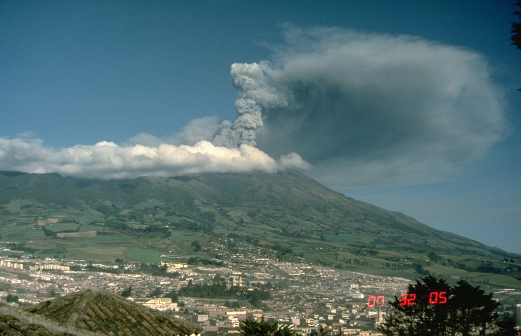 An ash plume from the summit crater of Galeras volcano rises above the city of Pasto on May 5, 1989.  Intermittent phreatic explosions ejected ash and blocks from the El Pinta vent beginning on February 19.  Periods of stronger activity took place on March 26-27 and May 4-9.  The May activity produced pyroclastic surges near the crater. Photo by Norm Banks, 1989 (U.S. Geological Survey).