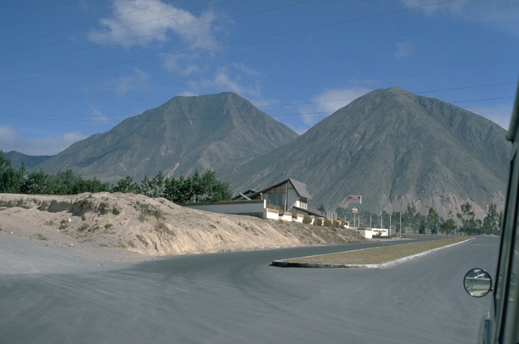 Cerro Sincholagua (left) and Loma la Marca (right) are the southernmost of a group of lava domes at Pululahua volcano. Seen here from the south, they are part of a chain of lava domes that were constructed on a roughly N-S line east of the Pululahua caldera. Photo by Lee Siebert, 1978 (Smithsonian Institution).