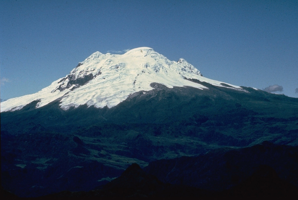 Antisana volcano is one of four massive glacier-covered stratovolcanoes constructed along a N-S line at the western edge of Ecuador's Cordillera Real.  Its summit crater is breached to the SE, behind the summit in this view from the NW.  Its only unequivocal historical eruption produced a lava flow from a NNE-flank vent at the beginning of the 19th century. Photo by Minard Hall, 1979 (Escuela Politécnica Nacional, Quito).