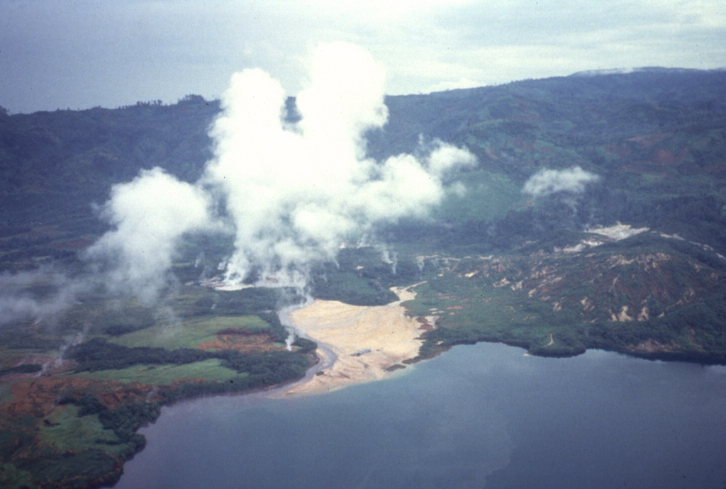 Steam plumes rise above the Danau Asam fumaroles on the west side of lake Asam within the 8 x 16 km Suoh depression in SE Sumatra. The depression appears to be primarily of tectonic origin, but contains historically active maars and silicic domes along its margins. Hot springs occur along faults and the Pematang Bata fumarole field are within the depression. Prior to a large explosive eruption in 1933 the floor of the Suoh depression was a broad marsh 13 km long in a NNW-SSE direction.  Anonymous, 1990.