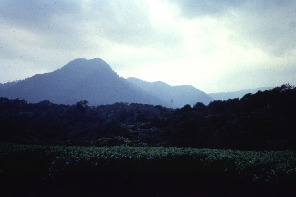 Kiaraberes-Gagak, seen here from the west, is part of the Perbakti-Gagak volcanic field. The eroded stratovolcano contains numerous fumarolic areas on its flanks. Pumice and obsidian deposits are at the top the volcano and obsidian lava flows extend to the N and NE. Mild phreatic eruptions took place in historical time from flank fumarole fields at the Perbakti-Gagak complex. Anonymous, 1989.