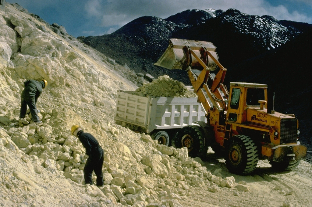 An active sulfur mine is located north of Cerro Sairecabur volcano.  This chain of volcanoes along the Chile-Bolivia border contains at least 10 postglacial centers.  The highest peak, Sairecabur, is located at the northern margin of a 4.5-km-wide caldera.  Postglacial activity began south of the summit, but most recently produced a pristine lava flow to the NW.   Escalante, at the northern end of the chain, has a crater lake at its summit and youthful lava flows on its flanks.  Other eruptive centers have also produced Holocene lava flows. Copyrighted photo by Katia and Maurice Krafft, 1983.