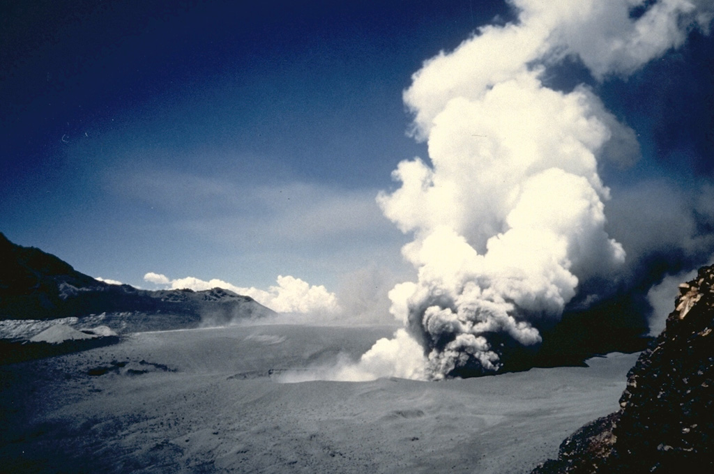 óAn explosive eruption lasting three weeks began on February 9, 1991 from a 200-m-wide crater between Planchon and Peteroa.  This photo shows an ash plume rising from the crater on February 11.  Ashfall occurred as far as 70 km from the crater.  Fish in the Claro and Teno rivers were killed and water supplies were contaminated by tephra and water ejected from the crater lake.   Photo by Moyra Gardeweg, 1991 (Servicio Nacional de Geología y Minería, Chile).