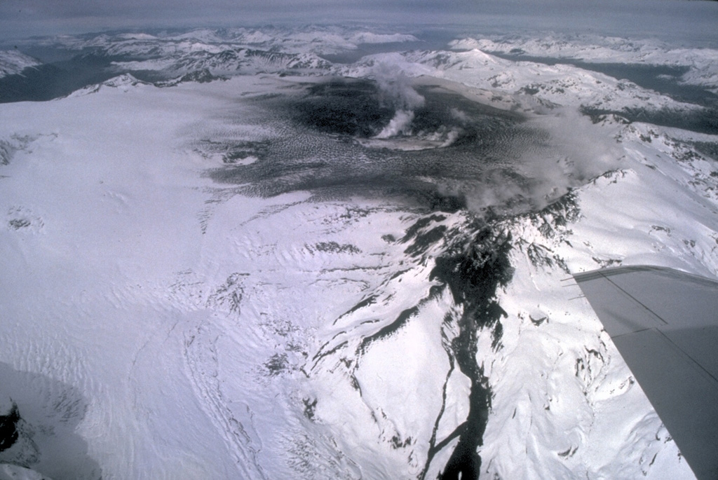 Chile's second largest explosive eruption of the 20th century began on August 8, 1991 from a fissure cutting the western rim of Cerro Hudson caldera.  The paroxysmal phase began on August 12 and was sustained for three days, producing ashfall that collapsed roofs near the volcano and fell in the Falkland Islands, 1000 km to the SE.  Pyroclastic flows were mostly restricted to the caldera floor.  The dark streak at the lower right-center is a lava flow that traveled 4 km down the WNW flank from the west caldera rim fissure.  Photo by Norm Banks, 1991 (U.S. Geological Survey).