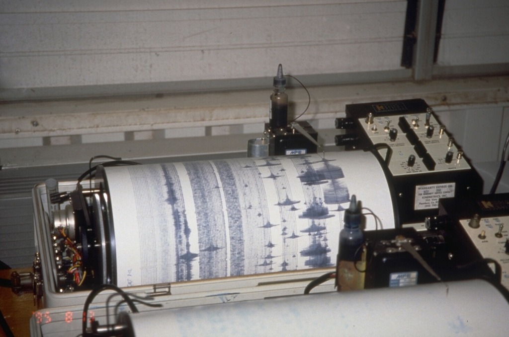 A seismogram at the Montserrat Volcano Observatory registers a volcano-tectonic earthquake swarm on August 12, 1995, several weeks after the start of a long-term eruption.  Seismic monitoring is one of several tools used to help predict future eruptions and keep tabs on ongoing activity. Photo by Cynthia Gardner, 1995 (U.S. Geological Survey).