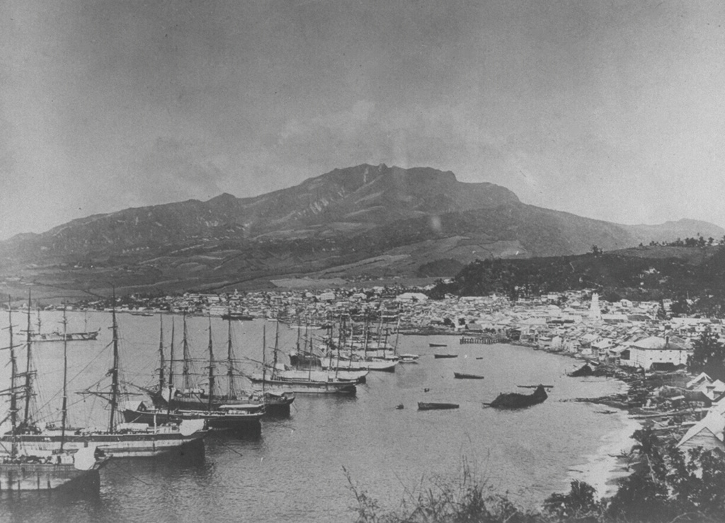 Ships line the harbor of St. Pierre before the catastrophic 1902 eruption.  Prior to 1902, St. Pierre was one of the leading ports of the Carribean.  At that time Mont Pelee was a forested volcano with a flat-topped summit.  Residents and officials of St. Pierre, in the foreground 7.5 km south of the volcano, were not concerned that the volcano posed a threat to the city.  Pelee had not erupted since 1851, and only minor phreatic eruptions had occurred then. From the collection of Maurice and Katia Krafft.