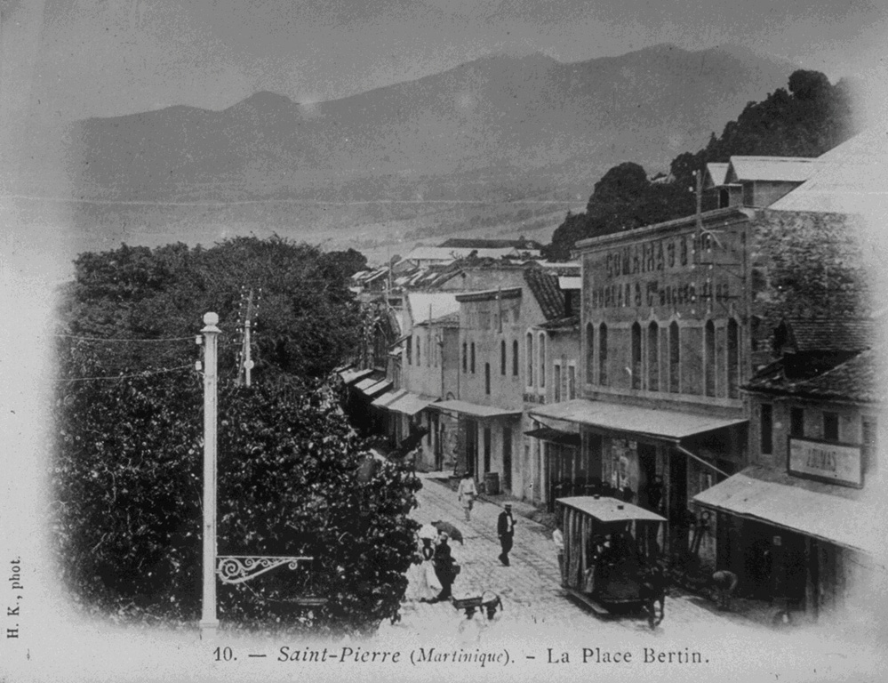 Prior to the 1902 eruption, St. Pierre was the largest and most beautiful city of the Lesser Antilles.  The forested slopes of the seemingly benign Mount Pelee provided a scenic backdrop to the thriving commercial center on the NW coast of Martinique.  The last eruption a half-century earlier had been a modest one, and even after the first explosions began on April  23, there was little concern.  No volcanological studies had been made, and official statements of reassurance kept most residents in the city until the devastating eruption of May 8. From the collection of Maurice and Katia Krafft.