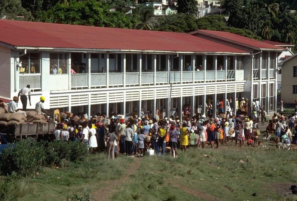 Evacuees from the 1979 eruption of Soufrière volcano pack a school building in Kingston, the capital of St. Vincent.  About 15,000 people were evacuated from the northern end of the island.  Most were allowed to return home on 14 May, although day-time-only access was permitted for 4000 people living within areas that had been affected by the 1902 eruption. Photo by Richard Fiske, 1979 (Smithsonian Institution).