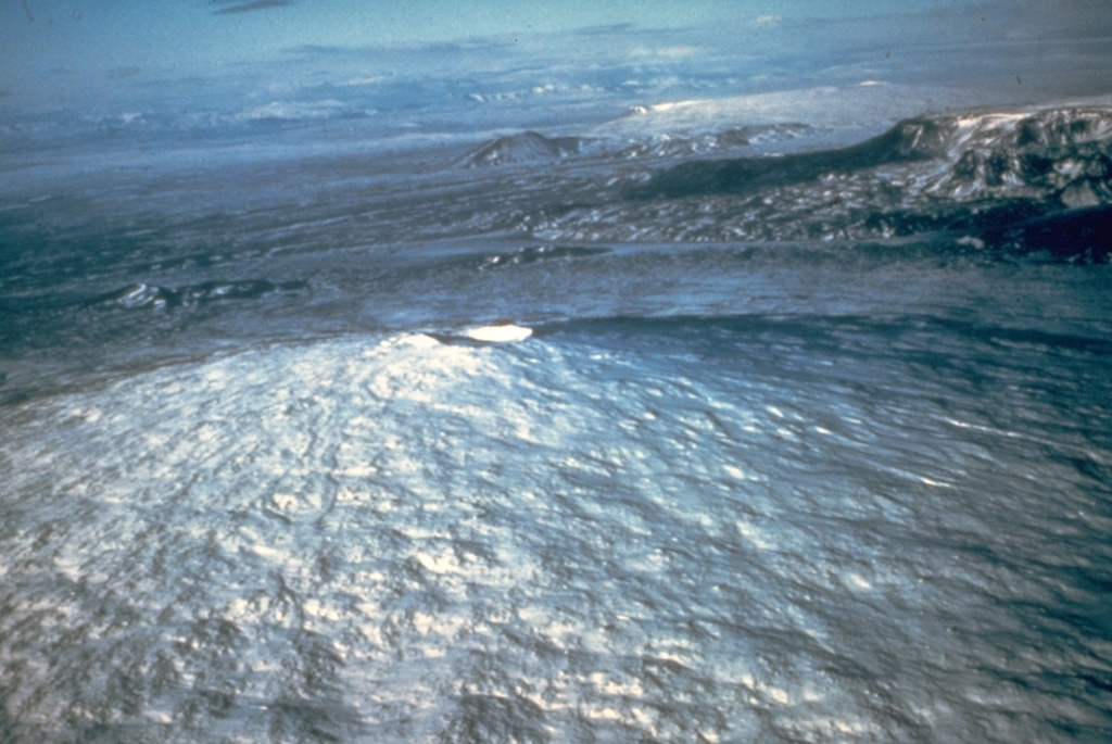 The broad shield volcano Skjaldbreiður (seen here) rises about 500 m above its surroundings, and has an approximately 300-m-wide summit crater. This volcano formed within the southern part of the Oddnyjarhnjukur-Langjokull volcanic system, between Thorsjökull glacier and Thingvallavatn lake, during the first half of the Holocene. Photo by Ingibjörg Kaldal (Orkustofunun, courtesy of Richie Williams, U.S. Geological Survey).