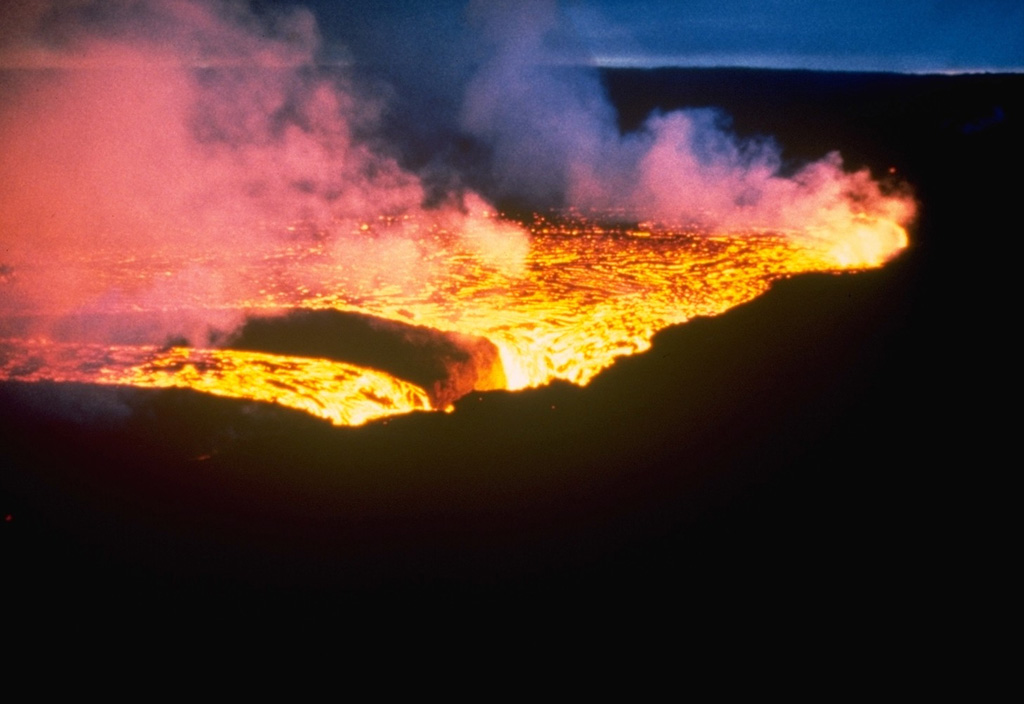 One spectacular feature of the July 1980 eruption at Krafla was the cascading of a 200-m-wide lava flow into an open preexisting fissure. Lava flowed into the fissure for several hours without filling it. Photo courtesy of Gudmundar Sigvaldason, 1980 (Nordic Volcanological Institute, Reykjavik).