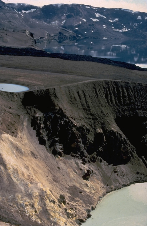 The steep-walled Viti crater in the foreground was formed during an eruption of Askja that began on January 1, 1875.  A powerful plinian phase beginning on March 28 was preceded by caldera collapse that continued slowly for several years.  Viti ("Hell") crater, now filled by a small lake, was created by phreatic eruptions that followed the plinian explosions. Copyrighted photo by Katia and Maurice Krafft, 1974.