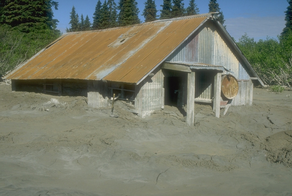 Lahars from the 1989-90 eruptions of Redoubt inundated a few structures in their path. The largest lahars traveled 35 km to the NE down the Drift River valley and reached the Cook Inlet. Photo by Cynthia Gardner, 1990 (U.S. Geological Survey).