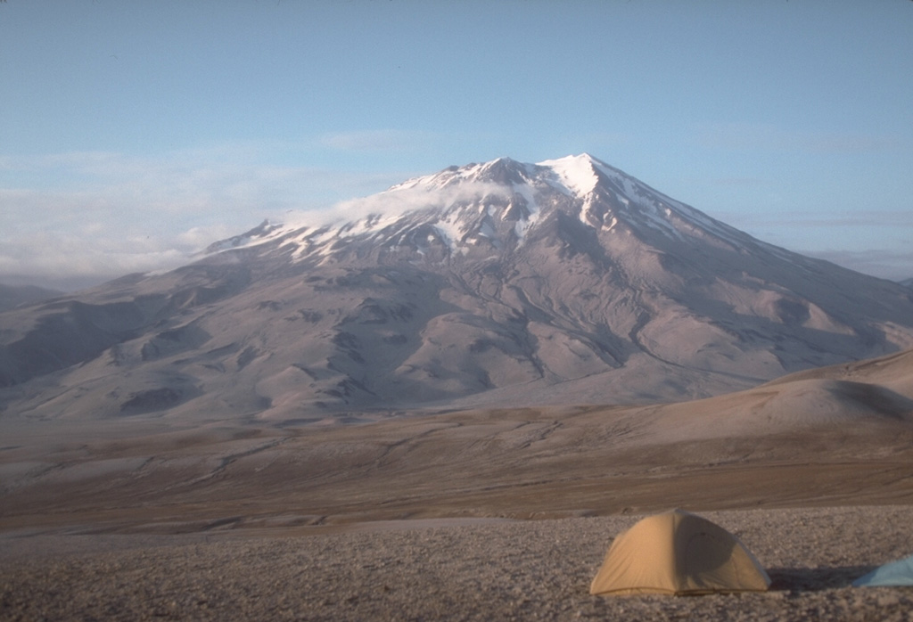 Griggs is the highest of a group of volcanoes in the Katmai area, located 10 km behind the volcanic arc. Active fumaroles are within the summit crater and along the upper SW flank. Tephra from the 1912 Novarupta eruption cover the flanks in this 1990 view from the SW. Photo by Game McGimsey, 1990 (U.S. Geological Survey, Alaska Volcano Observatory).