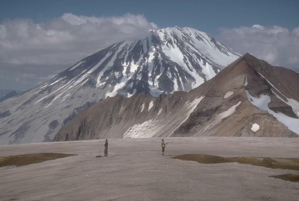 Griggs, seen here from the west rim of Katmai caldera, lies west of a NE-trending arc of volcanoes cutting across Katmai National Park. Noisy fumarolic jets at the summit can be heard across long distances. Photo by Game McGimsey (Alaska Volcano Observatory, U.S. Geological Survey).