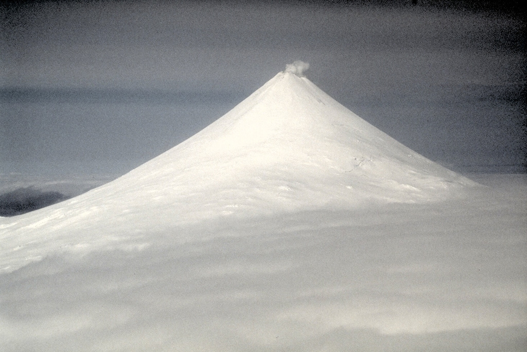 Shishaldin, located on central Unimak Island in the Aleutians, has a summit crater that emits a nearly continuous plume. It is the highest and one of the most active volcanoes of the Aleutian Islands. There have been frequent Strombolian eruptions, sometimes with lava flows, since the 18th century. Photo by Chris Nye (Alaska Division of Geological & Geophysical Surveys, Alaska Volcano Observatory).