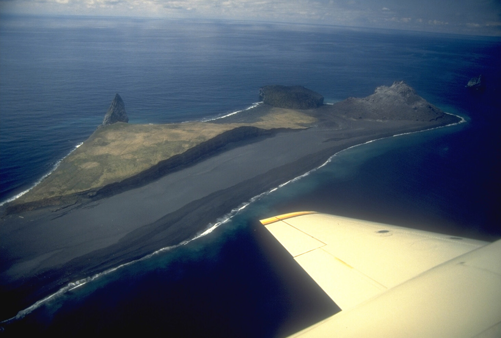 Lava dome remnants from three historical eruptions can be seen in this NW-looking aerial view of Bogoslof Island in the Aleutians. The pinnacle on the left is Castle Rock, also referred to as Old Bogoslof, a remnant of a 1796 lava dome. The circular, flat-topped area to its right is a remnant of a 1927 lava dome. The 1992 eruption produced the light-colored conical lava dome forming the tip of the island at top right. Regular eruptions and vigorous wave erosion frequently modify the island. Photo by Chris Nye, 1994 (Alaska Division of Geological & Geophysical Surveys).