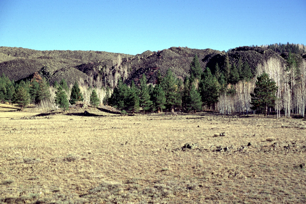 The thick blocky lava flow in the background near Panguitch Lake is the northern lobe of a voluminous flow that originated near Miller Knoll.  This flow is only one of several very youthful flows scattered over the Markagunt Plateau volcanic field of SW Utah.   Photo by Lee Siebert, 1996 (Smithsonian Institution)