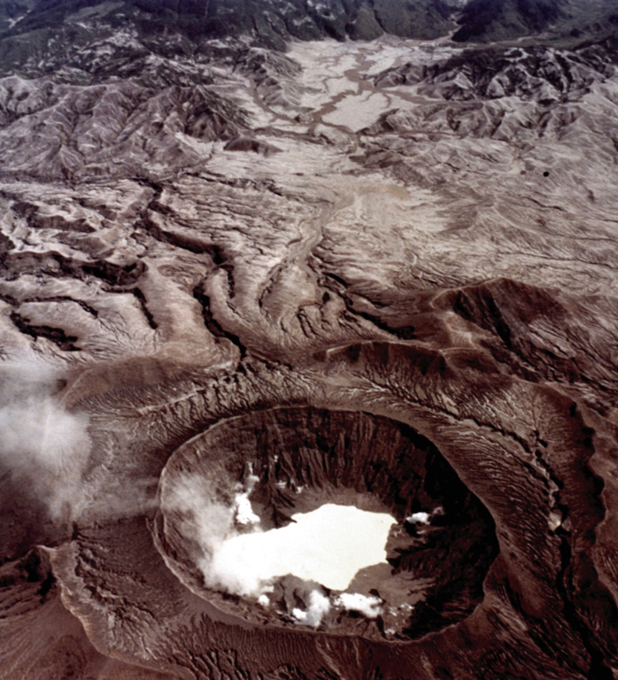 This view from the west on 4 November 1982 shows the impact of the El Chichón eruption about seven months later. Fumaroles are present around the new lake partially filling the crater, and the surrounding area was devastated by pyroclastic flows and surges. The 1982 crater is located within an older 1.5 x 1.9 km crater. NASA Space Shuttle image, 1982 (http://eol.jsc.nasa.gov/).