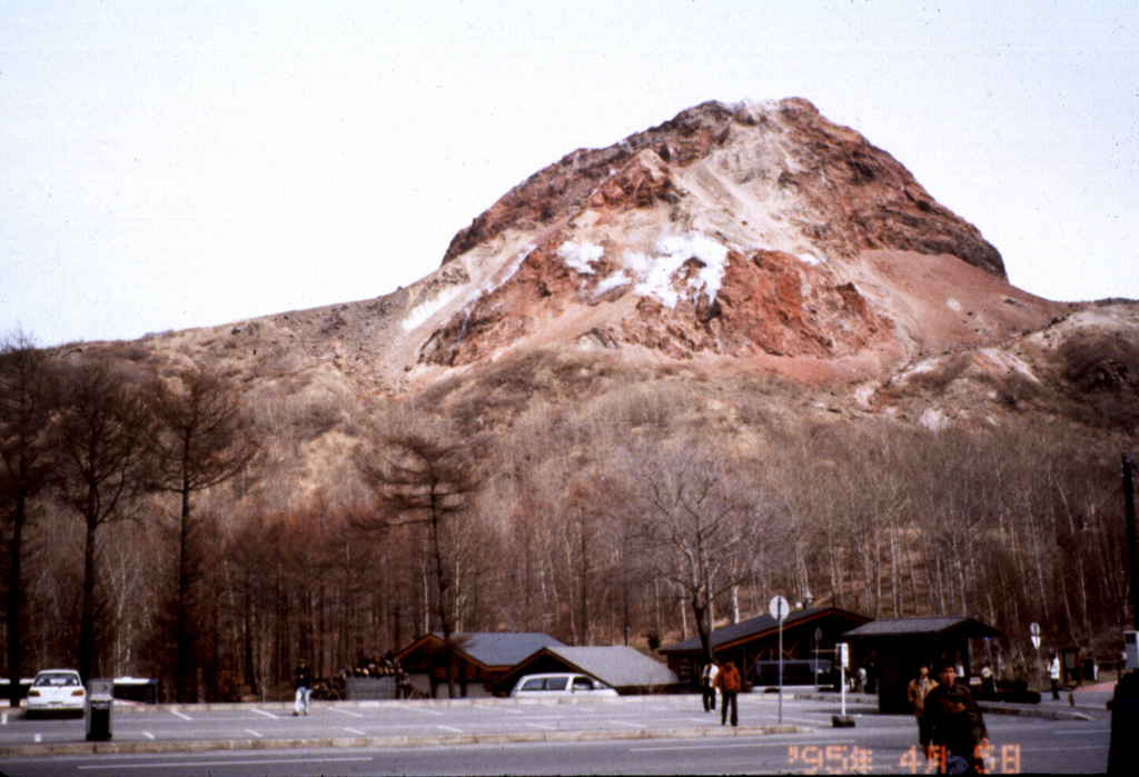 The Showa-Shinzan lava dome formed on the E flank of Usu volcano during eruptions in 1944-45. Rapid ground deformation initially raised flat cornfields to form a 150-m-high flat-topped hill on the lower E flank. Explosive eruptions from the center of the uplifted area began on 23 June 1944 and continued almost daily until 31 October. The dome breached the surface in November 1944 and ceased growing by September 1945 at a height of about 275 m. Photo by Mihoko Moriizumi (Hokkaido University).